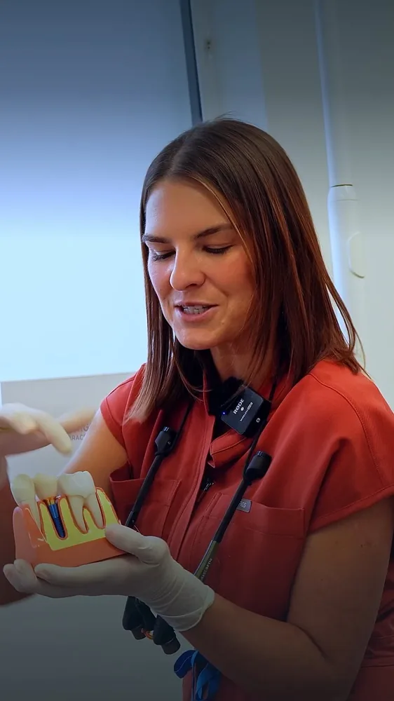 Rebecca explaining a dental model in a Balbriggan Braces video