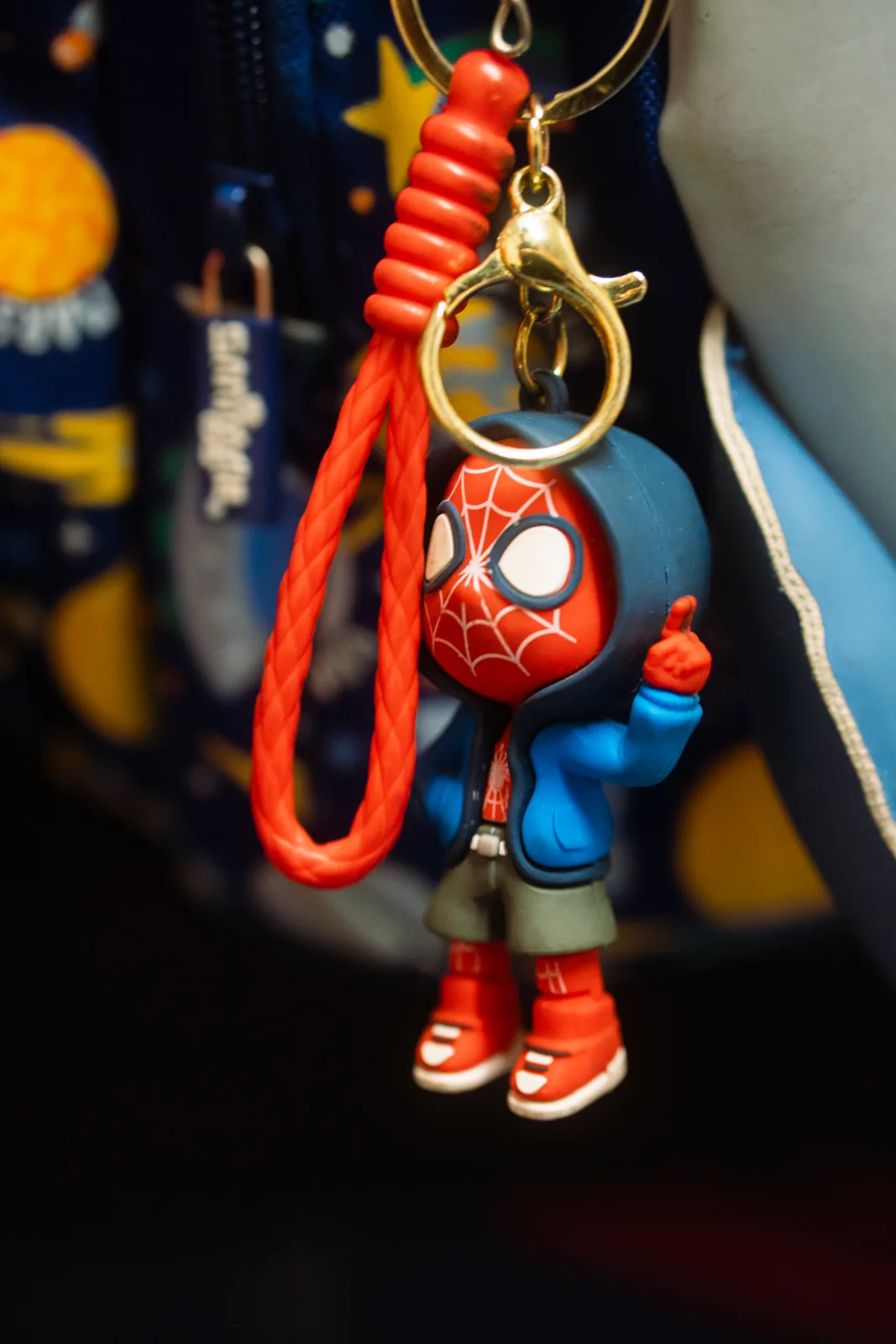 A small toy attached to a personal bag at Dió Dublin