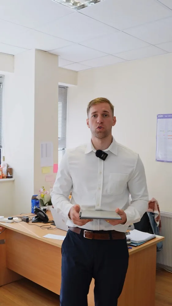The Perfect Clean owner speaking to camera in an office